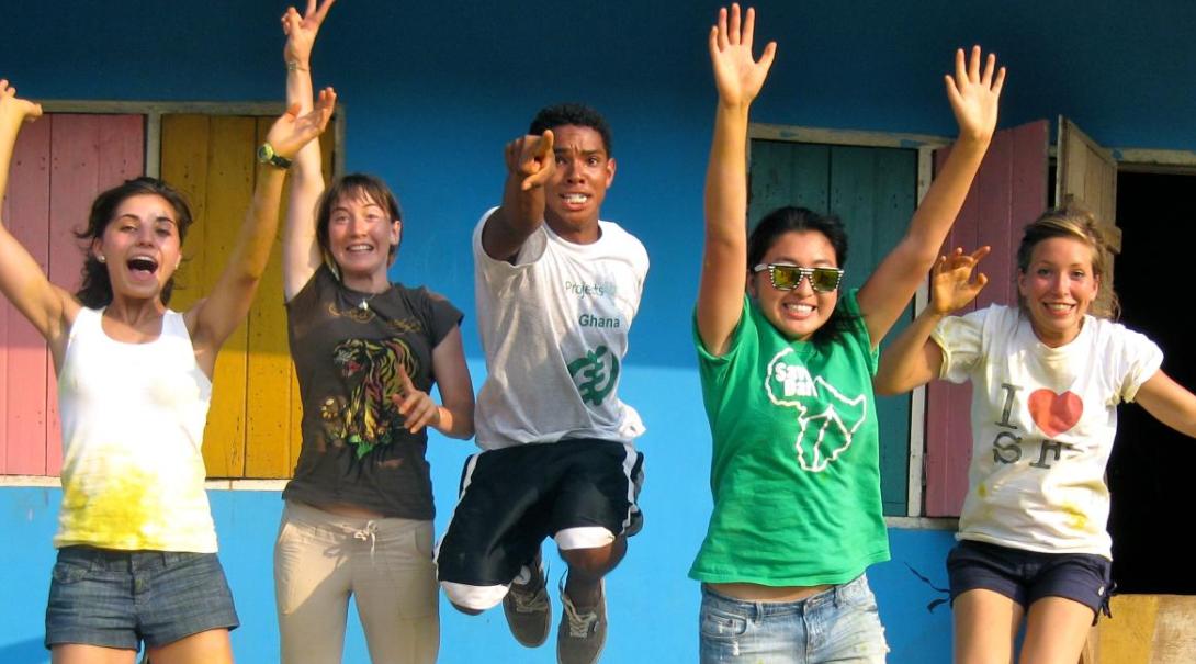 High school volunteers jump for joy High school students on volunteer project